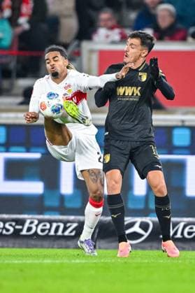 Lorenz Assignon (VfB Stuttgart) und Dimitris Giannoulis (FC Augsburg) im Zweikampf waehrend des spiels der Bundesliga zwischen VfB Stuttgart und FC Augsburg, MHPArena Stuttgart am 09. November 2025 in Stuttgart, Deutschland. (Foto von Harry Langer DeFodi Images) +++ Lorenz Assignon (VfB Stuttgart) und Dimitris Giannoulis (FC Augsburg) battle for the ball during the Bundesliga match between VfB Stuttgart and FC Augsburg at MHPArena Stuttgart on November 9, 2025 in Stuttgart, Germany. (Photo by Harry Langer DeFodi Images) DFL regulations prohibit any use of photographs as image sequences and or quasi-video. (Photo by Harry Langer DeFodi Images) DFL regulations prohibit any use of photographs as image sequences and or quasi-video. Lorenz Assignon VfB Stuttgart and Dimitris Giannoulis FC Augsburg in a duel during the Bundesliga match between VfB Stuttgart and FC Augsburg, MHPArena Stuttgart on November 09, 2025 in Stuttgart, Germany Photo by Harry Langer DeFodi Images Lorenz Assignon VfB Stuttgart and Dimitris Giannoulis FC Augsburg battle for the ball during the Bundesliga match between VfB Stuttgart and FC Augsburg at MHPArena Stuttgart on November 9, 2025 in Stuttgart, Germany Photo by Harry Langer DeFodi Images DFL regulations prohibit any use of photographs as image sequences and or quasi video Photo by Harry Langer DeFodi Images DFL regulations prohibit any use of photographs as image sequences and or quasi video