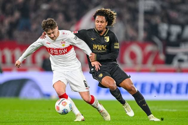 Angelo Stiller (VfB Stuttgart) und Han-Noah Massengo (FC Augsburg) im Zweikampf waehrend des spiels der Bundesliga zwischen VfB Stuttgart und FC Augsburg, MHPArena Stuttgart am 09. November 2025 in Stuttgart, Deutschland. (Foto von Harry Langer DeFodi Images) +++ Angelo Stiller (VfB Stuttgart) und Han-Noah Massengo (FC Augsburg) battle for the ball during the Bundesliga match between VfB Stuttgart and FC Augsburg at MHPArena Stuttgart on November 9, 2025 in Stuttgart, Germany. (Photo by Harry Langer DeFodi Images) DFL regulations prohibit any use of photographs as image sequences and or quasi-video. (Photo by Harry Langer DeFodi Images) DFL regulations prohibit any use of photographs as image sequences and or quasi-video. Angelo Stiller VfB Stuttgart und Han Noah Massengo FC Augsburg im Zweikampf waehrend des spiels der Bundesliga zwischen VfB Stuttgart und FC Augsburg, MHPArena Stuttgart am 09 November 2025 in Stuttgart, Germany Photo by Harry Langer DeFodi Images Angelo Stiller VfB Stuttgart und Han Noah Massengo FC Augsburg battle for the ball during the Bundesliga match between VfB Stuttgart and FC Augsburg at MHPArena Stuttgart on November 9, 2025 in Stuttgart, Germany Photo by Harry Langer DeFodi Images DFL regulations prohibit any use of photographs as image sequences and or quasi video Photo by Harry Langer DeFodi Images DFL regulations prohibit any use of photographs as image sequences and or quasi video