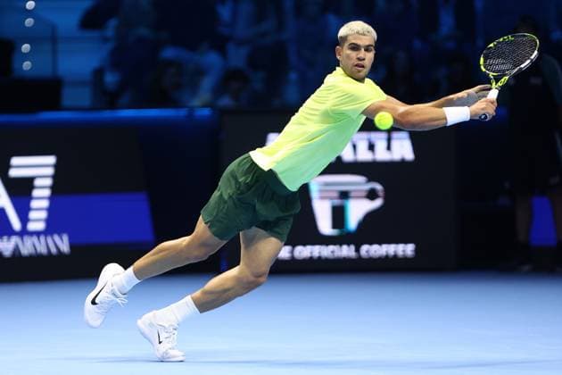 Carlos Alcaraz vs Alex De Minaur Carlos Alcaraz of Spain in action during the Round Robin singles match between Carlos Alcaraz of Spain and Alex De Minaur of Australia on Day One of the Nitto ATP, Tennis Herren World Tour Finals. Torino Inalpi Arena Italy Copyright: xMarcoxCanonierox