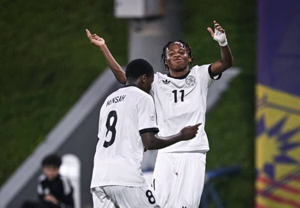 Football, Junior U 17 World Cup 2025 in Doha Qatar Preliminary round 10 11 2025 Group G El Salvador Germany JUBEL Germany Goalscorer to 1 0 Jeremiah Dennit Mensah left and goalscorer to 3 0 Wisdom Mike right