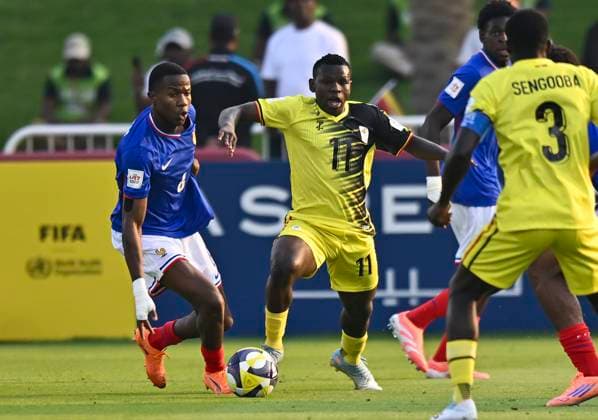 France v Uganda : Group K - FIFA U-17 World Cup Qatar 2025 Soan Ameline of France and Richard Okello of Uganda in action during the FIFA U-17 World Cup Qatar 2025 Group K match between France v Uganda in Doha, Qatar, on November 11, 2025. DOHA Qatar Copyright: xNOUSHADxTHEKKAYILx