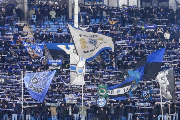 The Ultras of SV Waldhof Mannheim wave their flags in the fan curve, home fans, fan block, looking forward to the game, fans, audience, spectators, mood, atmosphere, stadium, 12 11 2025, Mannheim Germany , football, bfv Rothaus Pokal, quarter-final, SV Waldhof Mannheim FC Astoria Walldorf, DFB DFL REGULATIONS PROHIBIT ANY USE OF PHOTOGRAPHS AS IMAGE SEQUENCES AND OR QUASI VIDEO xozx