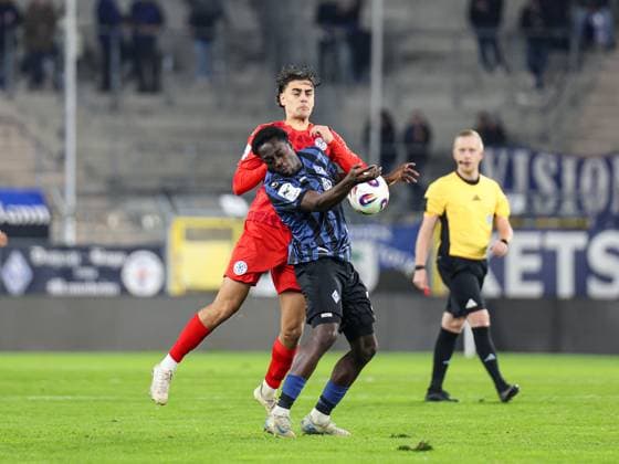 Kennedy Okpala SV Waldhof Mannheim, 32 and Felix Kendel FC Astoria Walldorf, 11 in a duel during the BfV Pokal quarterfinal SV Waldhof Mannheim 1860 Munich on 12 11 25 at Carl Benz Stadion, Mannheim xamx Photo Alfio Marino Copyright: