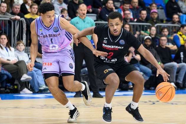 Jack Kayil of Alba Berlin, left, and Jhamir Brickus of Nymburk in action during the Basketball Champions League group B round 4 match Nymburk vs Alba Berlin in Prague, Czech Republic, November 12, 2025. (CTKxPhoto MichalxKamaryt) CTKPhotoP2025111207483  CTKPhotoP2025111207483