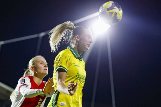 AMSTERDAM , 12-11-2025 , Sportpark de Toekomst , season 2025 2026 , UEFA Womens Europa Cup , Round of 16 1st leg , match between Ajax and Hammarby (women) , picture shows Hammarby player Ellen Wangerheim and Ajax player Bo van Egmond Ajax - Hammarby (women)  x31998459x Copyright: