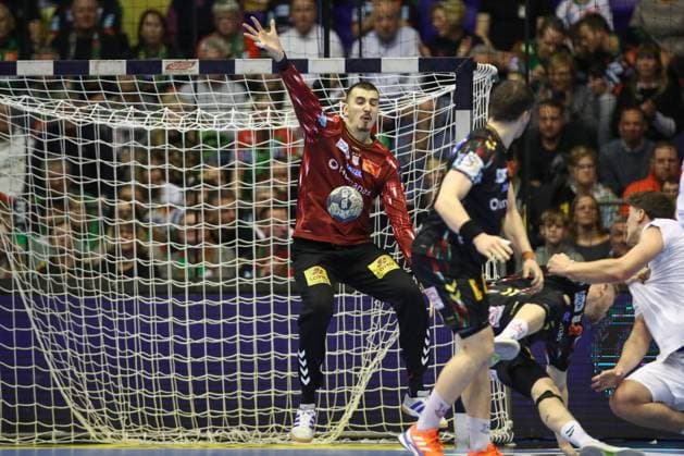 12 11 2025, xtgx, Handball, EHF Champions League, SC Magdeburg HC Zagreb v l Matej Mandic Magdeburg, 12 Parade, holds the ball, catches the ball, parries Magdeubrg