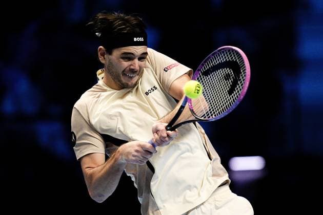 United States™ Taylor Fritz returns the ball to Australia s Alex de Minaur during the singles tennis match of the ATP, Tennis Herren World Tour Finals at the Inalpi Arena in Turin, Italy - Thursday, Nov. 13, 2025. -  Copyright: xMarcoxAlpozzi LaPressex