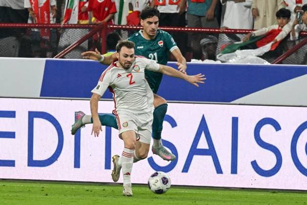 UAE v Iraq - 2026 AFC World Cup Qualifiers ABU DHABI, UNITED ARAB EMIRATES - NOVEMBER 13: Ruben Canedo (L) of UAE in action against Hussein Jabbar (R) of Iraq during the first match of the fifth round of the 2026 FIFA World Cup, WM, Weltmeisterschaft, Fussball Asian Qualifiers at the Mohammed bin Zayed Stadium in Abu Dhabi, United Arab Emirates, on November 13, 2025. Waleed Zein Anadolu Abu Dhabi United Arab Emirates. Editorial use only. Please get in touch for any other usage.  Copyright: x2025xAnadoluxWaleedxZeinx