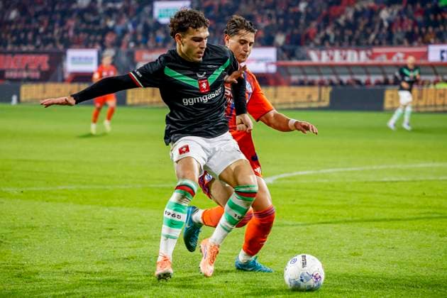 Guilherme Peixoto of FC Twente and Ayman Emran Gulasi of Schalke 04 battle for the ball FC Twente v FC Schalke 04, 60th Anniversary Game, FC Twente v Schalke 04, De Grolsch Veste Stadium, November 13, 2025, Enschede, Netherlands.