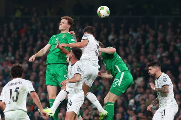 Jake O Brien of the Republic of Ireland is challenges by Ruben Dias of Portugal and Antonio Silva of Portugal Republic of Ireland v Portugal, FIFA 2026 World Cup Qualifying, Group F, Football, Aviva Stadium, Dublin, Ireland - 13 Nov 2025Dublin Aviva Stadium Ireland EDITORIAL USE ONLY No use with unauthorised audio, video, data, fixture lists, club league logos or live services. Online in-match use limited to 120 images, no video emulation. No use in betting, games or single club league player publications. Copyright: xLorrainexO Sullivan Shutterstockx 15759346ab
