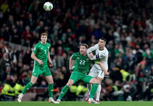 2026 FIFA World Cup, WM, Weltmeisterschaft, Fussball Qualifier Group F, Aviva Stadium, Dublin 13 11 2025 Republic of Ireland vs Portugal Ireland s Nathan Collins in action with Portugal s Cristiano Ronaldo Nathan Collins in action with Cristiano Ronaldo 13 11 2025  Copyright: x INPHO NickxElliottx IMG_9311