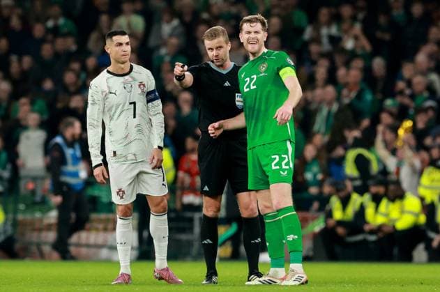 2026 FIFA World Cup, WM, Weltmeisterschaft, Fussball Qualifier Group F, Aviva Stadium, Dublin 13 11 2025 Republic of Ireland vs Portugal Portugal s Cristiano Ronaldo and Ireland s Nathan Collins Referee Glenn Nyberg Cristiano Ronaldo, Nathan Collins, and Glenn Nyberg 13 11 2025  Copyright: x INPHO MorganxTreacyx 0U6A1091_1