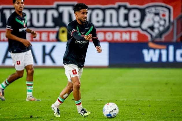 Naci Unuvar of FC Twente dribbles with the ball FC Twente v FC Schalke 04, 60th Anniversary Game, FC Twente v Schalke 04, De Grolsch Veste Stadium, November 13, 2025, Enschede, Netherlands.