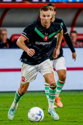 Arno Verschueren of FC Twente dribbles with the ball FC Twente v FC Schalke 04, 60th Anniversary Game, FC Twente v Schalke 04, De Grolsch Veste Stadium, November 13, 2025, Enschede, Netherlands.