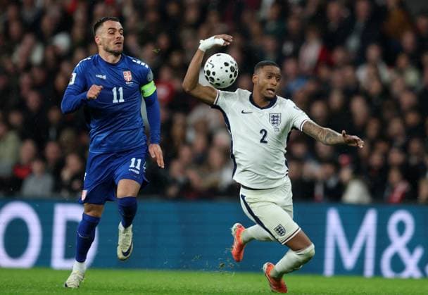 Filip Kostic of Serbia with Ezri Konsa of England England v Serbia - UEFA World Cup Qualifiers - Group K. Football. Wembley Stadium, London. UK. 13 NOV 2025Wembley Wembley Stadium London United Kingdom Editorial use only  Copyright: xJASONPIX Shutterstockx 15785832bf