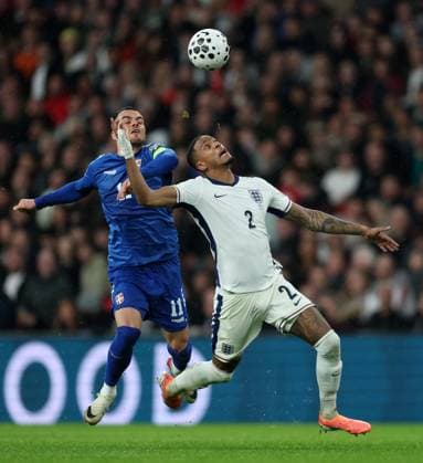 Filip Kostic of Serbia with Ezri Konsa of England England v Serbia - UEFA World Cup Qualifiers - Group K. Football. Wembley Stadium, London. UK. 13 NOV 2025Wembley Wembley Stadium London United Kingdom Editorial use only  Copyright: xJASONPIX Shutterstockx 15785832ay