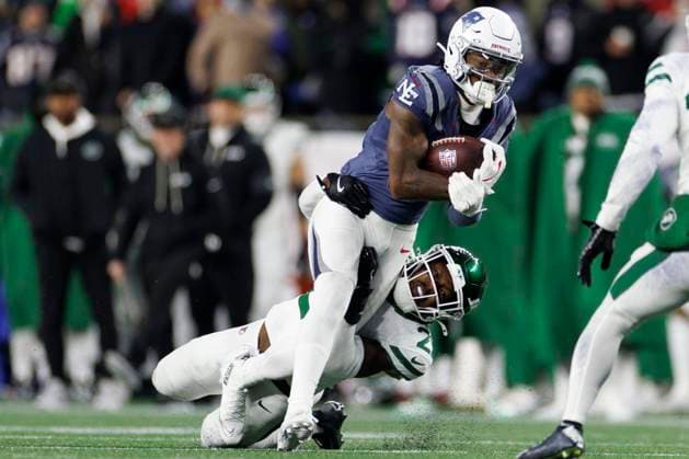 New York Jets cornerback Brandon Stephens, left, tackles New England Patriots wide receiver Stefon Diggs, right, during the first half at Gillette Stadium in Foxborough, Massachusetts on Thursday, November 13, 2025.  BOP20251113020 CJxGUNTHER