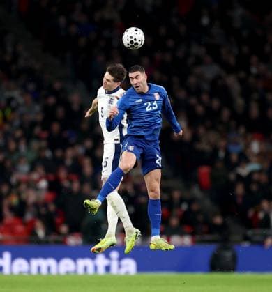 (251114) -- LONDON, Nov. 14, 2025 -- England s John Stones (L) vies with Serbia s Dusan Vlahovic during the World Cup 2026 European Qualifiers group K football match between England and Serbia in London, Britain, Nov. 13, 2025. ) (SP)BRITAIN-LONDON-FOOTBALL FIFA World Cup, WM, Weltmeisterschaft, Fussball EUROPEAN QUALIFIERS-ENGLAND VS SERBIA LixYing 