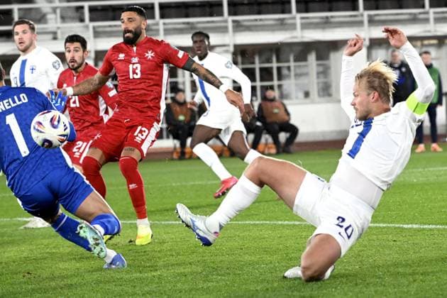 Malta s goalkeeper Henry Bonello (L) stops the shot from Finland s Joel Pohjanpalo during the FIFA World Cup, WM, Weltmeisterschaft, Fussball 2026 Group G European qualification football match between Finland and Malta in Helsinki, Finland, on November 14, 2025. Background Malta s Enrico Pepe (13) and Juan Corbalan (21). Helsinki Finland LKFTJK20251114193839SYWU  Copyright: xHeikkixSaukkomaax LKFTJK20251114193839SYWU