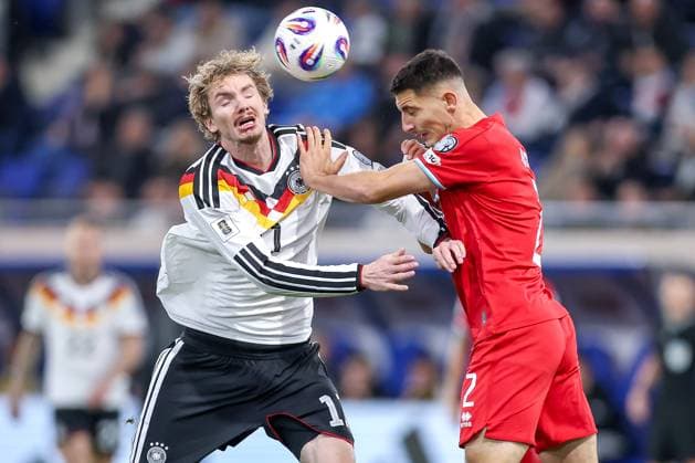 14 11 2025, Football, International match, World Cup Qualification Europe, Germany Luxembourg, Stade de Luxembourg Croix de Gasperich, Luxembourg , Matchday 9, Season 2025 2026 Nick Woltemade GER 11 in duel against Seid Korac LUX 02 Regulations prohibit any use of photographs as image sequences and or quasi video Luxembourg