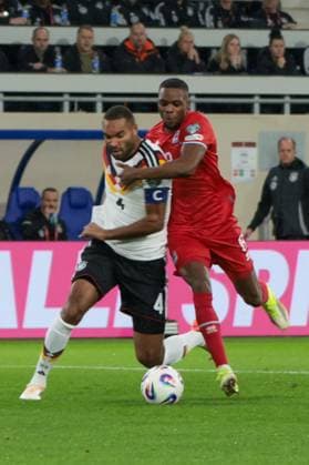 14 11 2025, xhettx, Football World Cup Qualification 2026, Luxembourg Germany v l Jonathan Tah Germany, 4 and Christopher Martins Luxembourg, 8 in duel DFL DFB REGULATIONS PROHIBIT ANY USE OF PHOTOGRAPHS as IMAGE SEQUENCES and or QUASI VIDEO Luxembourg