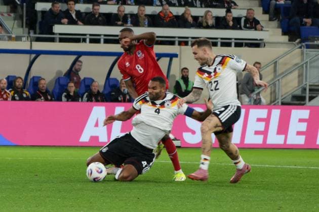 14 11 2025, xhettx, Football World Cup Qualification 2026, Luxembourg Germany v l Christopher Martins Luxembourg, 8 prevails against 4 and David Raum Germany, 22 DFL DFB REGULATIONS PROHIBIT ANY USE OF PHOTOGRAPHS as IMAGE SEQUENCES and or QUASI VIDEO Luxembourg