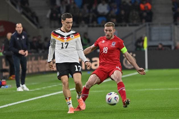 14 11 2025, xjrdrx, Football, World Cup Qualification 2026 Luxembourg Germany emspor, v l Florian Wirtz Germany , Laurent Jans Luxembourg, 18 DFL DFB REGULATIONS PROHIBIT ANY USE OF PHOTOGRAPHS as IMAGE SEQUENCES and or QUASI VIDEO Luxembourg