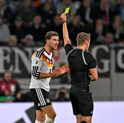 14 11 2025, Football World Cup Qualification Europe 2025 26, Matchday 9, Luxembourg Germany, at Stade de Luxembourg Croix de Gasperich, Luxembourg , Leon Goretzka Germany is shown a yellow card by referee John Brooks England