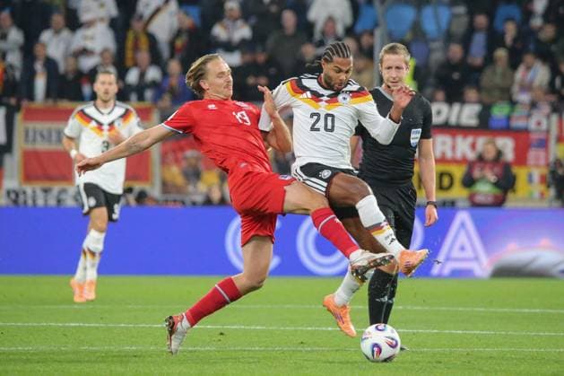 14 11 2025, xflhrx, Football World Cup Qualification 2026 Luxembourg Germany emspor, v l Mathias Olesen Luxembourg, 19 , Serge Gnabry Germany, duel, fight, tackle DFL DFB REGULATIONS PROHIBIT ANY USE OF PHOTOGRAPHS as IMAGE SEQUENCES and or QUASI VIDEO Luxembourg