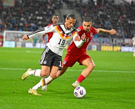 14 11 2025, Football World Cup Qualification Europe 2025 26, Matchday 9, Luxembourg Germany, at Stade de Luxembourg Croix de Gasperich, Luxembourg , v l Leroy Sane Germany v Dirk Carlson Luxembourg
