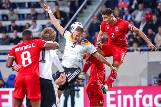 14 11 2025, Football, International match, World Cup Qualification Europe, Germany Luxembourg, Stade de Luxembourg Croix de Gasperich, Luxembourg , Matchday 9, Season 2025 2026 Waldemar Anton GER 03 in duel against Seid Korac LUX 02 Regulations prohibit any use of photographs as image sequences and or quasi video Luxembourg