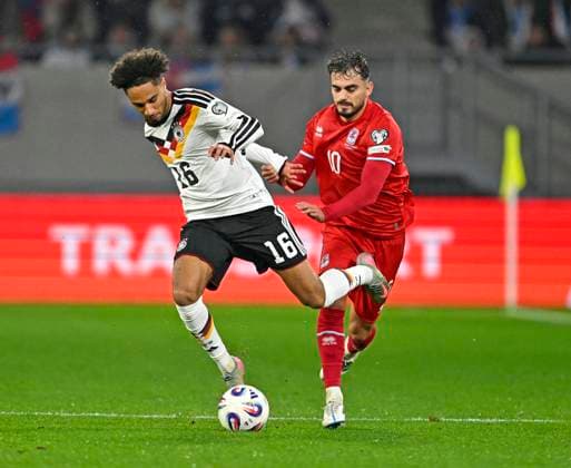 14 11 2025, Soccer World Cup Qualification Europe 2025 26, Matchday 9, Luxembourg Germany, at Stade de Luxembourg Croix de Gasperich, Luxembourg , v l Kevin Schade Germany vs Daniel Sinani Luxembourg