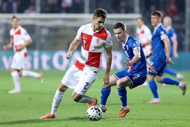 Croatia v Faroe Islands - FIFA World Cup, WM, Weltmeisterschaft, Fussball 2026 Qualifier RIJEKA, CROATIA - NOVEMBER 14: Josip Stanisic of Croatia and Petur Knudsen of Faroe Islands competes for the ball during the FIFA World Cup 2026 qualifier match between Croatia and Faroe Islands at HNK Rijeka Stadium on November 14, 2025 in Rijeka, Croatia.  NelxPavletic PIXSELL