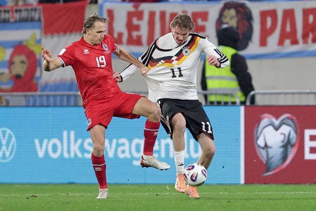 Nick Woltemade Germany 11 in duel with Mathias Olesen Luxembourg 19 Football, UEFA World Cup Qualifiers 2026, Season 2025 2026, Group A, European Qualifiers 14 11 2025 Luxembourg Germany Luxembourg vs Germany Stade de Luxembourg, Luxembourg