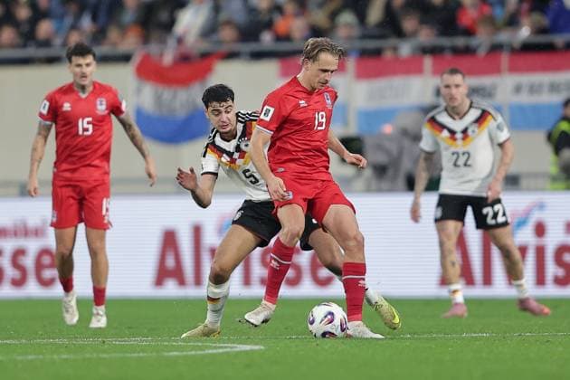 Mathias Olesen Luxembourg 19 in duel with Aleksandar Pavlovic Germany 5 Football, UEFA World Cup Qualification 2026, Season 2025 2026, Group A, European Qualifiers 14 11 2025 Luxembourg Germany Luxembourg vs Germany Stade de Luxembourg, Luxembourg
