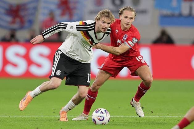 Nick Woltemade Germany 11 in duel with Mathias Olesen Luxembourg 19 Football, UEFA World Cup Qualifiers 2026, Season 2025 2026, Group A, European Qualifiers 14 11 2025 Luxembourg Germany Luxembourg vs Germany Stade de Luxembourg, Luxembourg