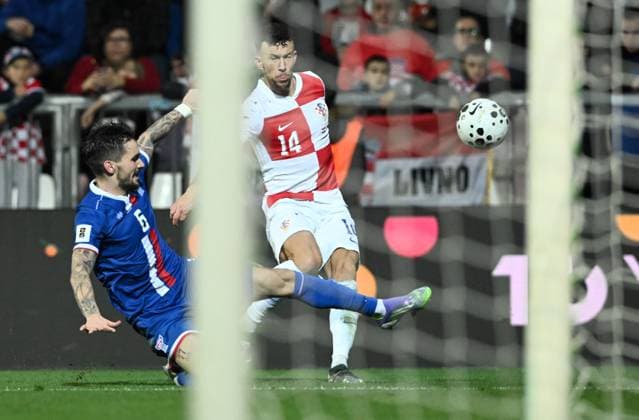 Croatia v Faroe Islands - FIFA World Cup, WM, Weltmeisterschaft, Fussball 2026 Qualifier RIJEKA, CROATIA - NOVEMBER 14: Ivan Perisic of Croatia pass the ball whilst under pressure from Rene Joensen of Faroe Islands during the FIFA World Cup 2026 qualifier match between Croatia and Faroe Islands at HNK Rijeka Stadium on November 14, 2025 in Rijeka, Croatia.  MarkoxLukunic PIXSELL