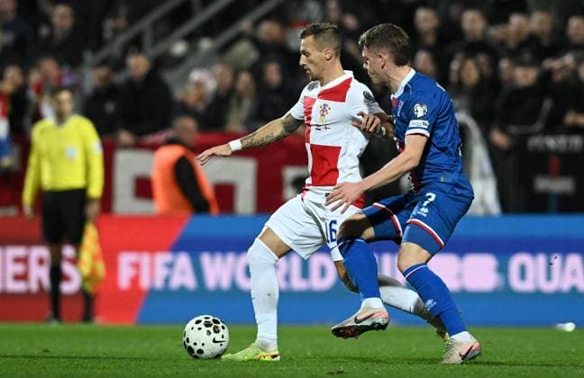 Croatia v Faroe Islands - FIFA World Cup, WM, Weltmeisterschaft, Fussball 2026 Qualifier RIJEKA, CROATIA - NOVEMBER 14: Mislav Orsic of Croatia competes for the ball with Joannes Bjartalid of Faroe Islands during the FIFA World Cup 2026 qualifier match between Croatia and Faroe Islands at HNK Rijeka Stadium on November 14, 2025 in Rijeka, Croatia.  MarkoxLukunic PIXSELL