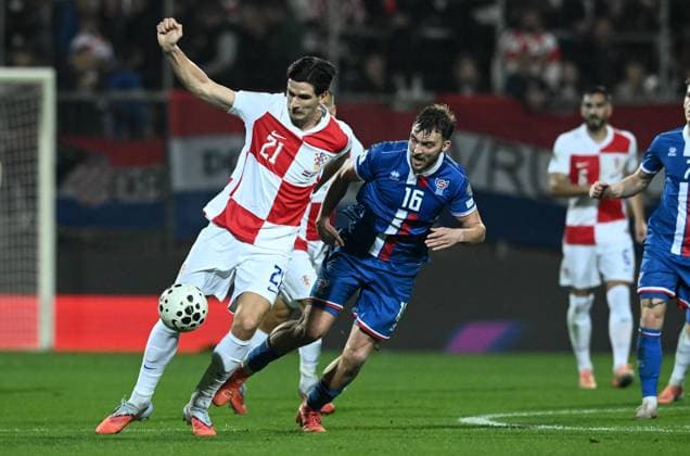 Croatia v Faroe Islands - FIFA World Cup, WM, Weltmeisterschaft, Fussball 2026 Qualifier RIJEKA, CROATIA - NOVEMBER 14: Igor Matanovic of Croatia copmetes for the ball with Gunnar Vatnhamar of Faroe Islands during the FIFA World Cup 2026 qualifier match between Croatia and Faroe Islands at HNK Rijeka Stadium on November 14, 2025 in Rijeka, Croatia.  MarkoxLukunic PIXSELL