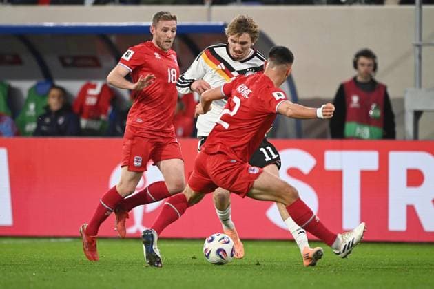 v l Laurent JANS LUX , Nick WOLTEMADE GER , Seid KORAC LUX , action, duel, Luxembourg LUX Germany GER 0 2 Soccer international, World Cup Qualification Europe Group A, matchday 9, matchday9, on 14 1 2025, Stade de Luxembourg, Luxembourg, Â