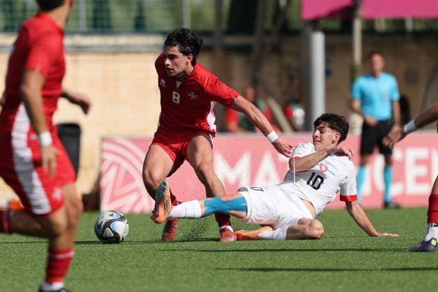 Thomas Melillo (left) of Malta is in action against Marek Naskos of Czechia during the 2025 26 UEFA European Under-19 Championship qualifying round group 13 soccer match between Czechia U-19 and Malta U-19 at the Centenary Stadium, Ta Qali, Malta on 15 November 2025. Czechia v Malta Under-19 UEFA European Qualifying