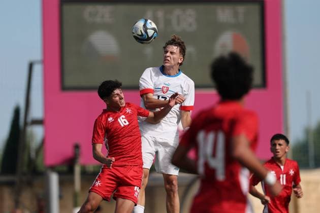 Adam Sosna (top) of Czechia is in action against Liam Micallef of Malta during the 2025 26 UEFA European Under-19 Championship qualifying round group 13 soccer match between Czechia U-19 and Malta U-19 at the Centenary Stadium, Ta Qali, Malta on 15 November 2025. Czechia v Malta Under-19 UEFA European Qualifying