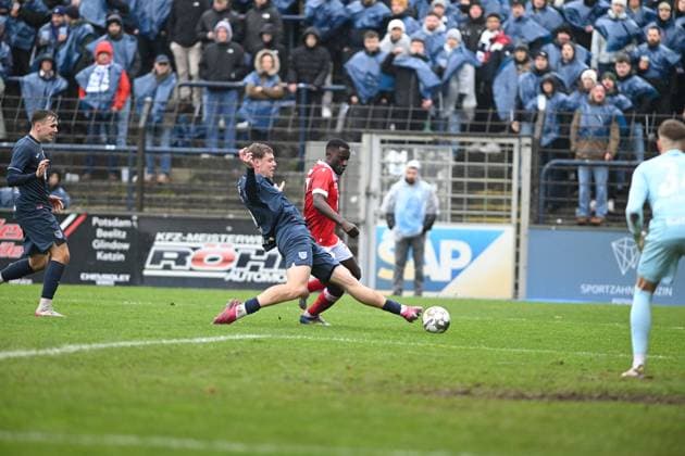 Nils Schätzle 8 SV Babelsberg 03 tackles Merveille Biankadi 37 FC Energie Cottbus , while Kenny Weyh 5 SV Babelsberg 03 defends tackle for ball Copyright: xSpeedshotx