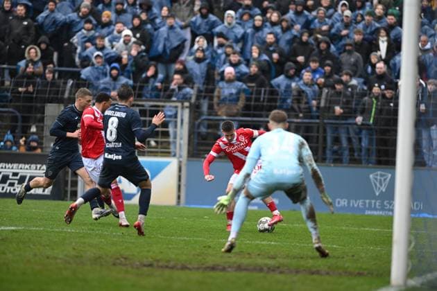 Lukas Michelbrink 8 FC Energie Cottbus with ball in front of goal while Jannis Lang 3 SV Babelsberg 03 defends attack in front of goal Copyright: xSpeedshotx
