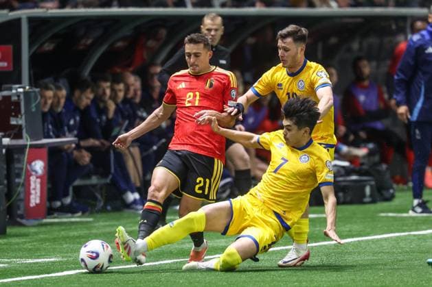 Belgium s Timothy Castagne and Kazakhstan Galymzhan Kenzhebek fight for the ball during a soccer game between Kazakhstan and Belgium s Red Devils, Saturday 15 November 2025 in Astana, Kazakhstan, qualification game 7 8 for the 2026 FIFA World Cup, WM, Weltmeisterschaft, Fussball VIRGINIExLEFOUR  x141771444x