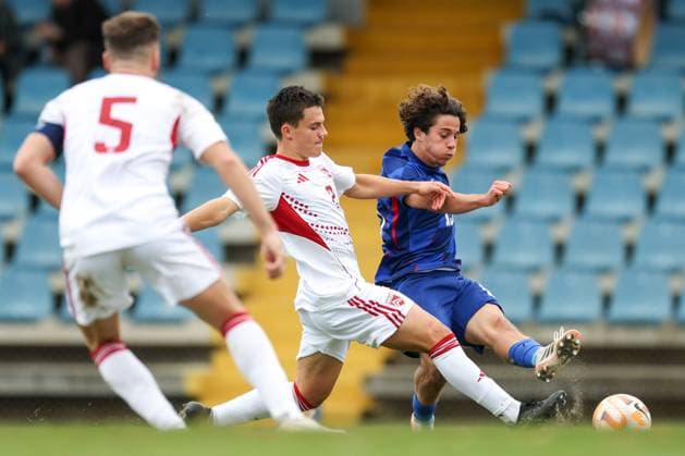European Championships qualifiers match, Croatia U-19, Gibrltar U-19 Lovro Chelfi of Croatia and Joachim Ostheider of Gibraltar compete for a ball during round 2 of European Championships 2026 qualifiers match between U19 Croatia and U19 Gibraltar at Branko Cavlovic-Cavlek Stadium on November 15, 2025 in Karlovac, Croatia.  IgorxKralj PIXSELL