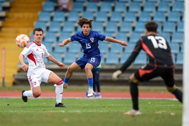 European Championships qualifiers match, Croatia U-19, Gibrltar U-19 Lovro Chelfi of Croatia and Joachim Ostheider of Gibraltar during round 2 of European Championships 2026 qualifiers match between U19 Croatia and U19 Gibraltar at Branko Cavlovic-Cavlek Stadium on November 15, 2025 in Karlovac, Croatia.  IgorxKralj PIXSELL