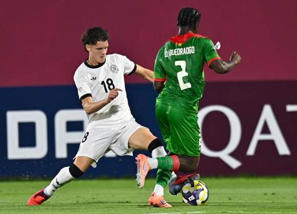 Germany v Burkina Faso: Round of 32- FIFA U-17 World Cup Qatar 2025 Christian Prenaj of Germany and Ousmane Ouedraogo of Burkina Faso in action during the FIFA U-17 World Cup Qatar 2025 Round of 32 match between Germany and Burkina Faso in Doha, Qatar, on November 15, 2025. DOHA Qatar Copyright: xNOUSHADxTHEKKAYILx