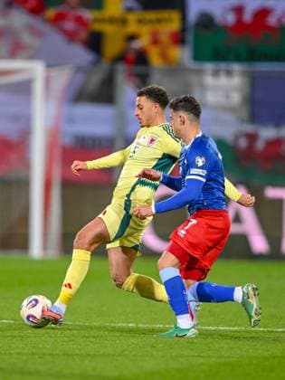 Ethan Ampadu Wales and Fabio Luque Notaro Liechtenstein battle for the ball during the FIFA World Cup 2026 qualifier match between Liechtenstein and Wales at Rheinpark Stadion on November 15, 2025 in Vaduz, Liechtenstein Photo by Harry Langer DeFodi Images