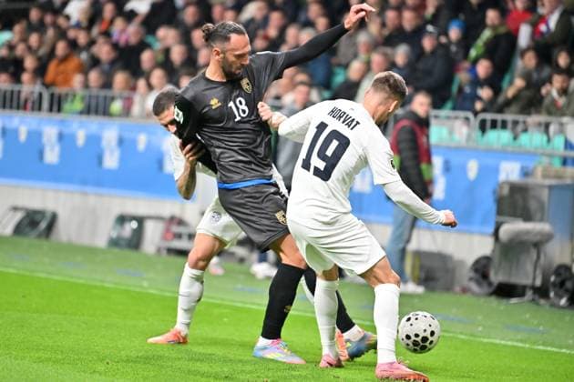 Ljubljana, Slovenia, November 15th 2025, Vedat Muriqi of Kosovo (L) in action against Tomi Horvat of Slovenia (R) during the UEFA European Qualifiers for 2026 World Cup, Group B match between Slovenia and Kosovo at Stadium Stozice, Ljubljana, Slovenia. (Photo by Igor Kupljenik Sports Press Photo) Copyright: xIgorxKupljenikx xSPPx Sportspressphoto_SPR62154